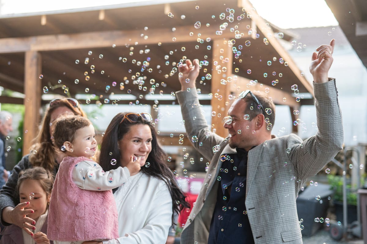 Hire bubble machine — family celebrates joyful moment with bubbles outdo for parties and events in Johannesburg, Sandton and Randburg