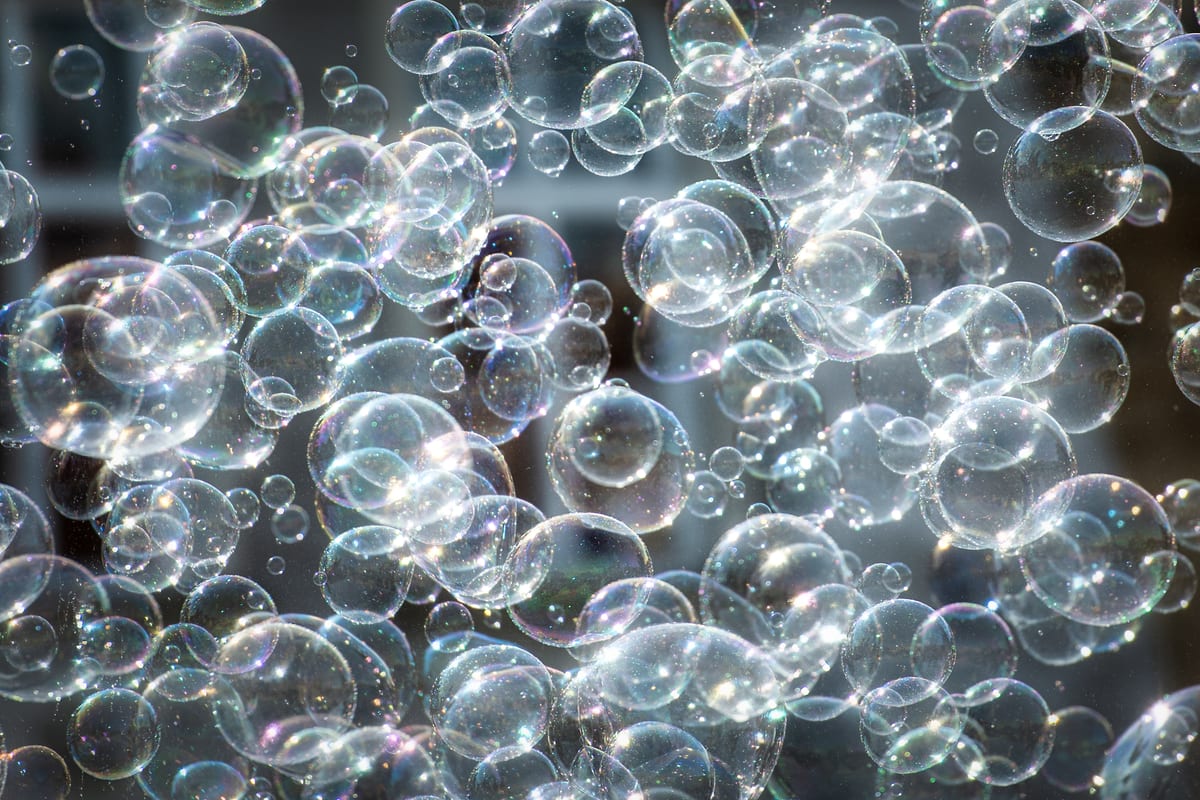 Hire bubble machine — shimmering soap bubbles floating in air with refle for parties and events in Johannesburg, Sandton and Randburg