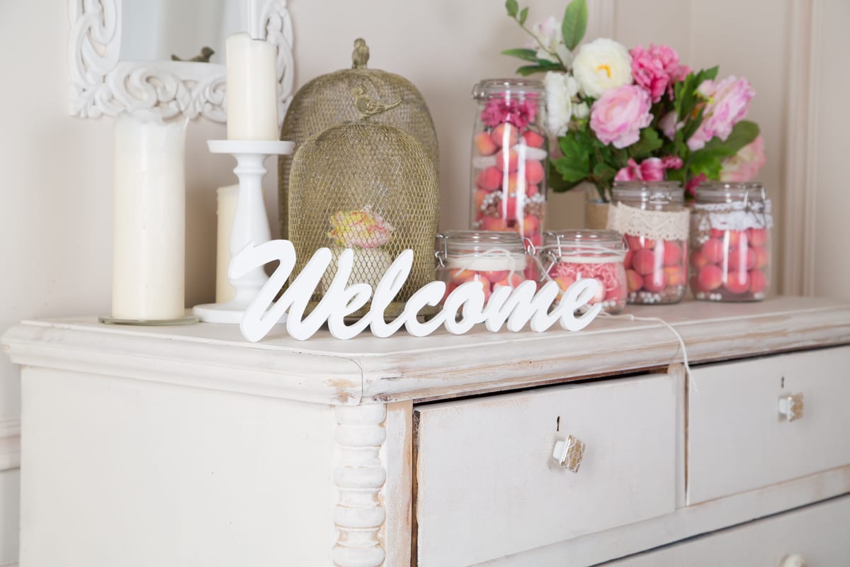 Hire candy cart — vintage decorated table with pink flowers and cand for parties and events in Johannesburg, Sandton and Randburg