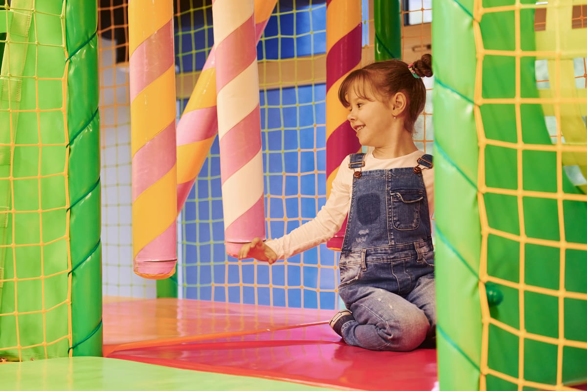 Soft Play hire — happy little girl in casual clothes have fun in ch | Panda Party Hire Hire soft play equipment — happy little girl in casual clothes have fun in ch for parties and events in Johannesburg, Sandton and Randburg