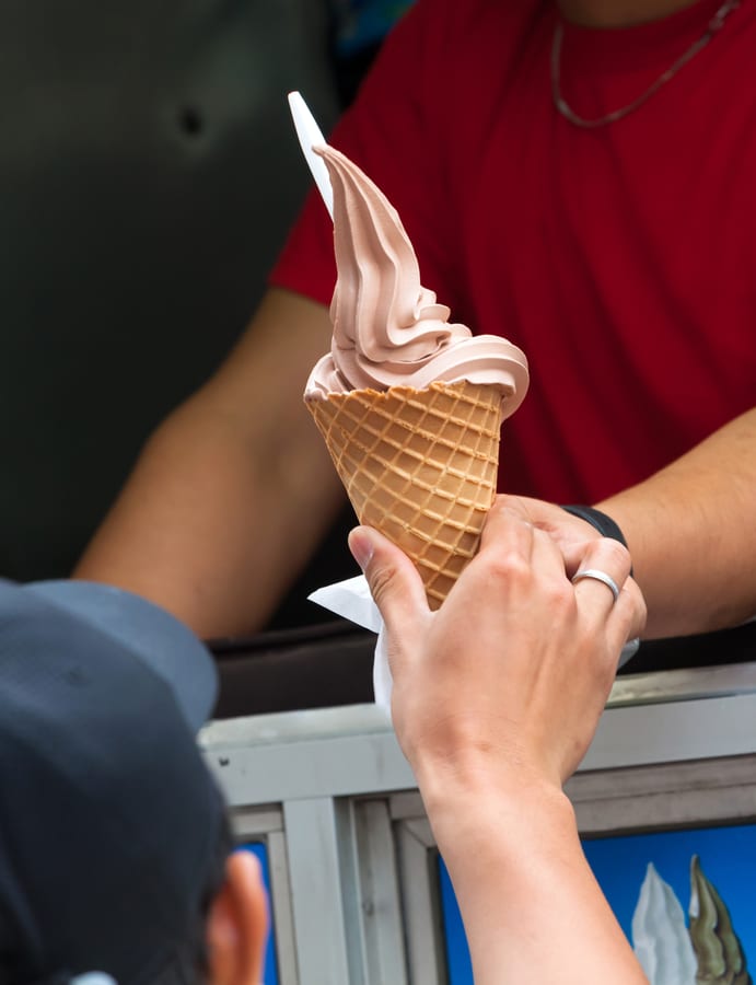 Soft Serve Machine hire — receiving an ice cream cone from the vendor | Panda Party Hire Hire soft serve machine — receiving an ice cream cone from the vendor for parties and events in Johannesburg, Sandton and Randburg