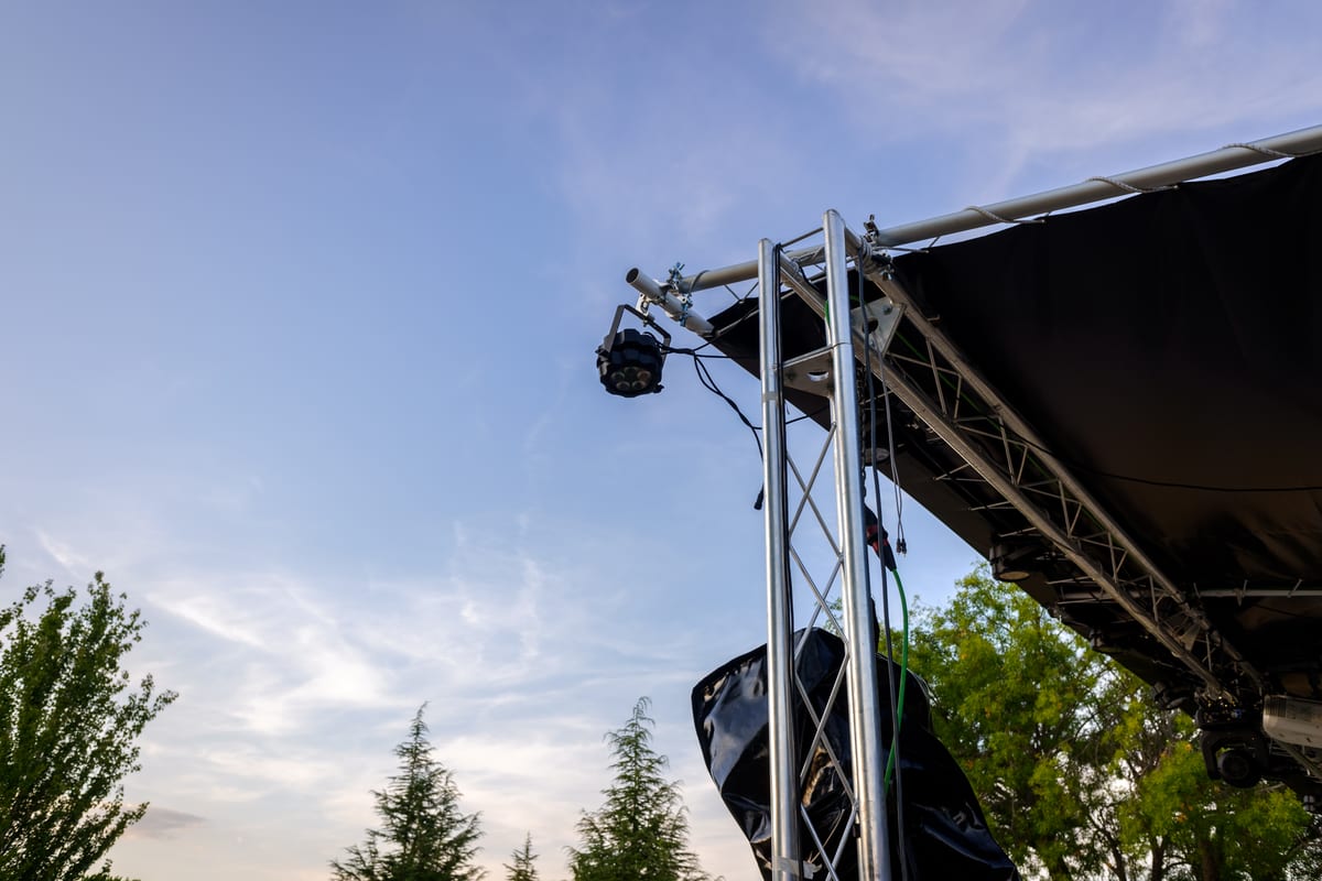 Sound System hire — upward view of stage lighting against blue sky | Panda Party Hire Hire sound system — upward view of stage lighting against blue sky for parties and events in Johannesburg, Sandton and Randburg