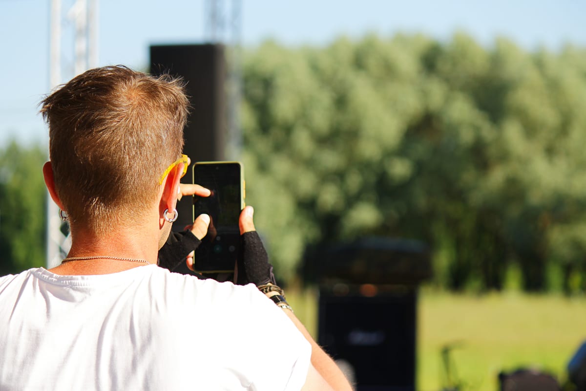 Sound System hire — a person takes pictures of an entertaining street | Panda Party Hire Hire sound system — a person takes pictures of an entertaining street for parties and events in Johannesburg, Sandton and Randburg