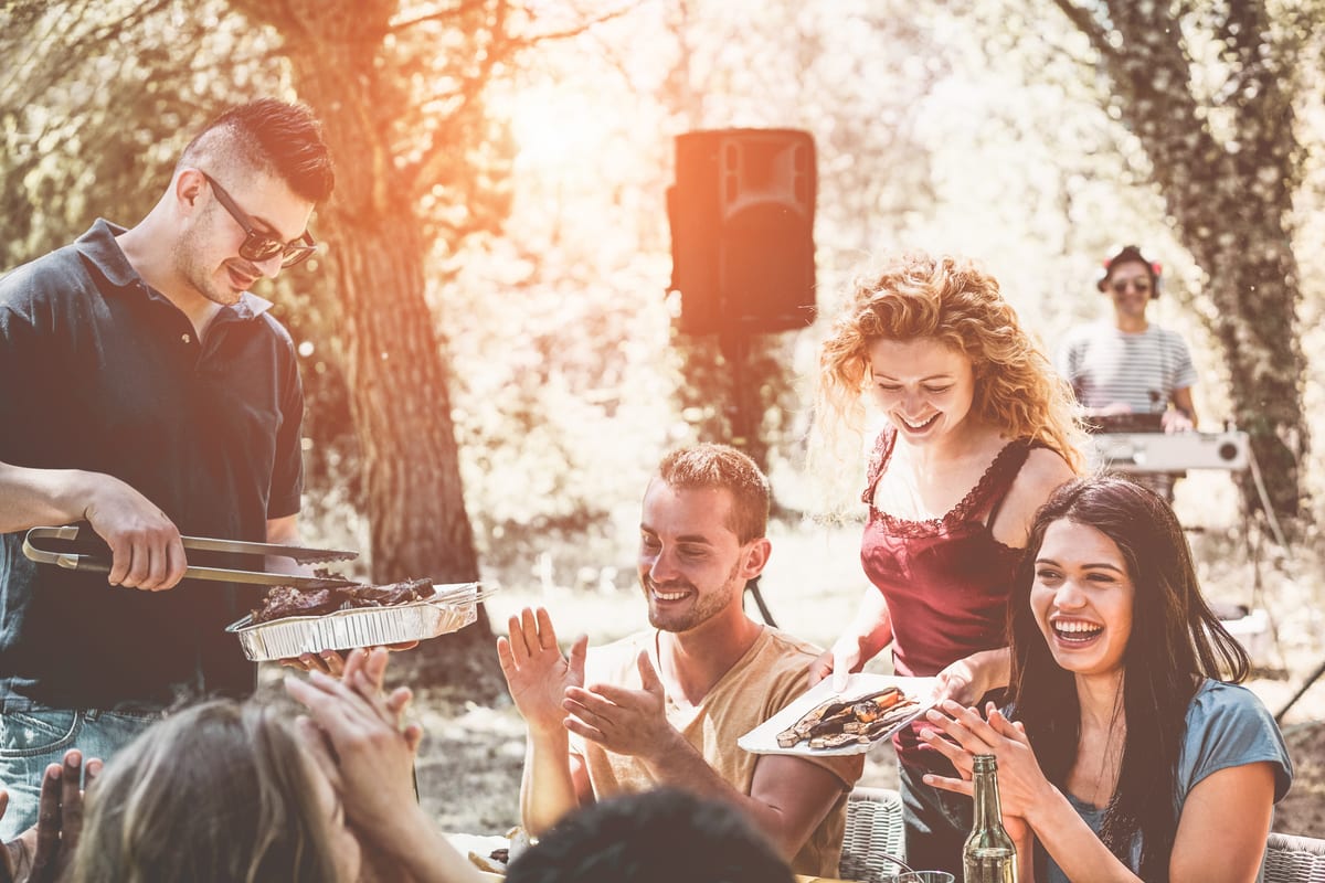 Sound System hire — happy friends eating and drinking at barbecue part | Panda Party Hire Hire sound system — happy friends eating and drinking at barbecue part for parties and events in Johannesburg, Sandton and Randburg