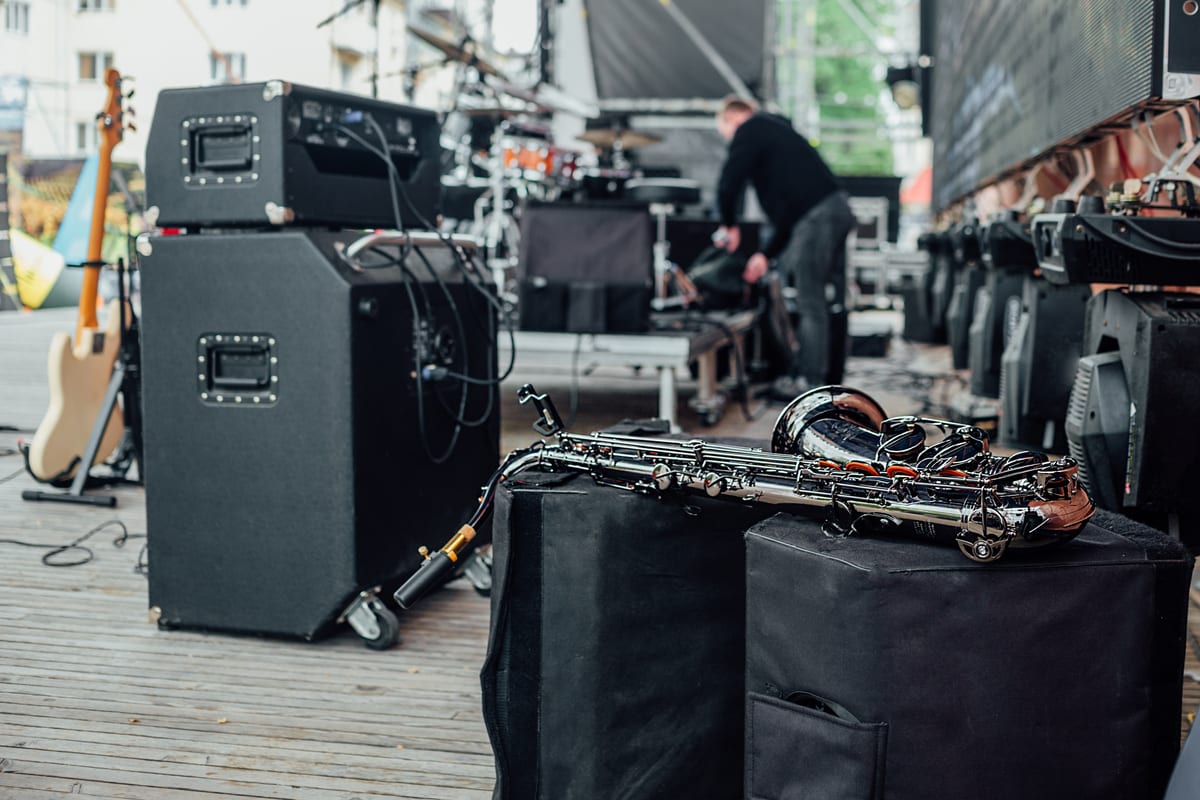 Sound System hire — shiny saxophone instrument on stage with musical e | Panda Party Hire Hire sound system — shiny saxophone instrument on stage with musical e for parties and events in Johannesburg, Sandton and Randburg
