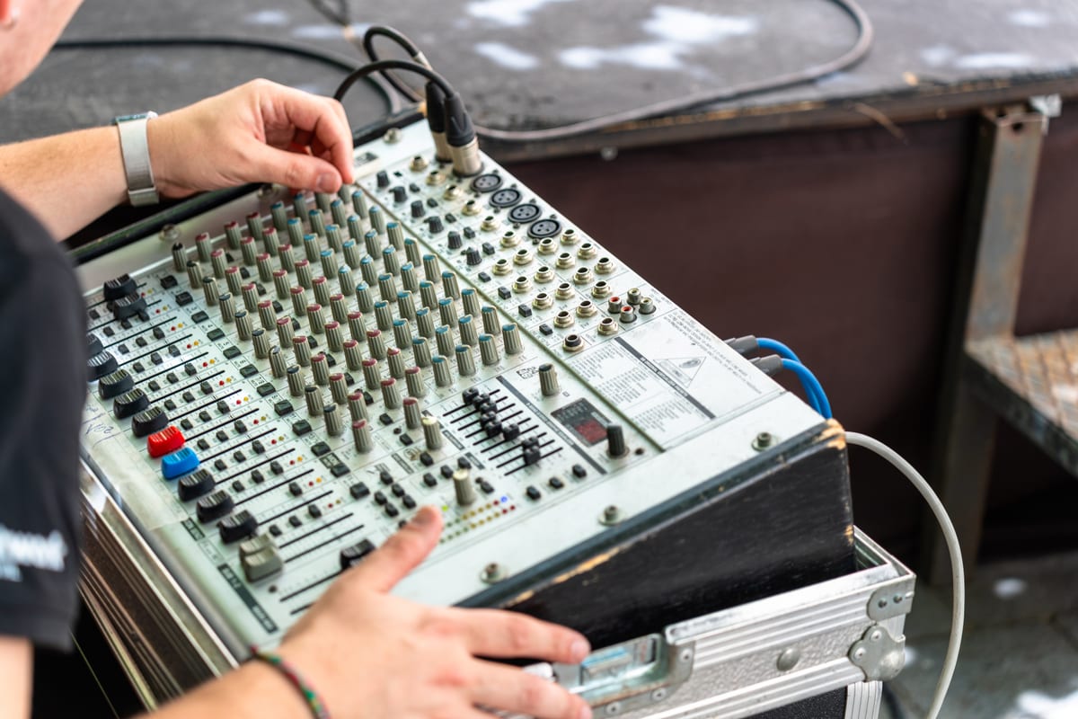 Sound System hire — sound engineer working with a professional sound c | Panda Party Hire Hire sound system — sound engineer working with a professional sound c for parties and events in Johannesburg, Sandton and Randburg
